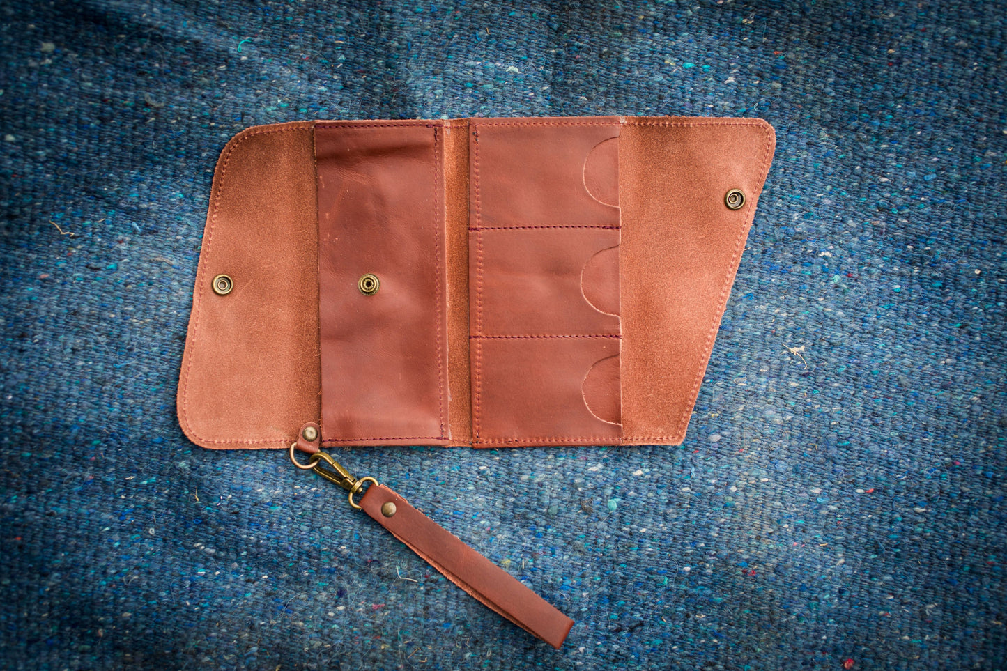 Saddler tri-fold wristlet